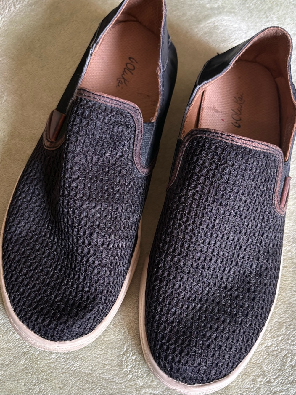 OluKai Black Slip-On Women's Flats with Tan Trim